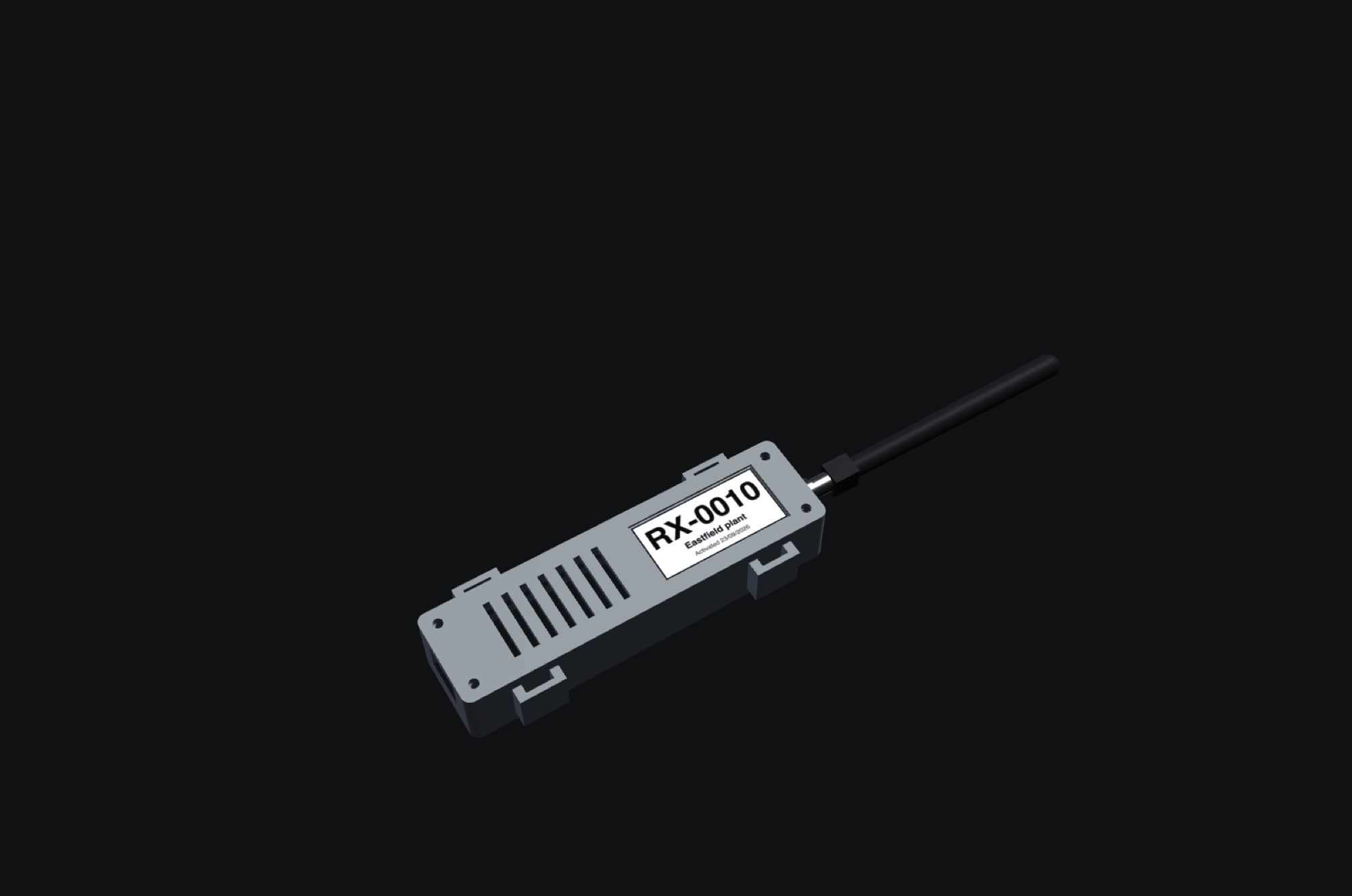 A receiver: a small grey case about the size of a large matchbox with a label reading RX-0010, an aerial on one end and vents along the lid.